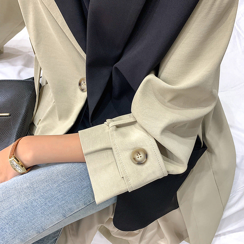 Women’s oversized trench coat with a contrasting yoke and roll-up sleeves