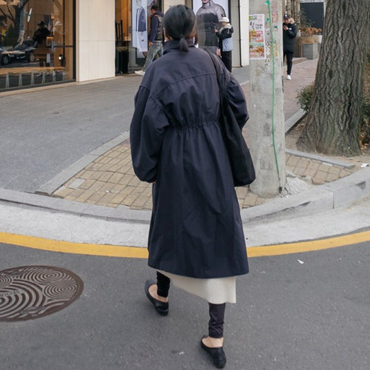 Women's oversized coat with stand-up collar, drawstring waist, and balloon sleeves