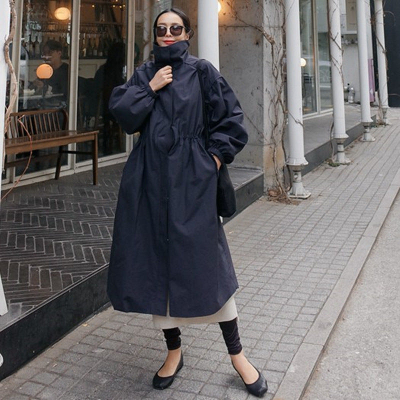 Women's oversized coat with stand-up collar, drawstring waist, and balloon sleeves