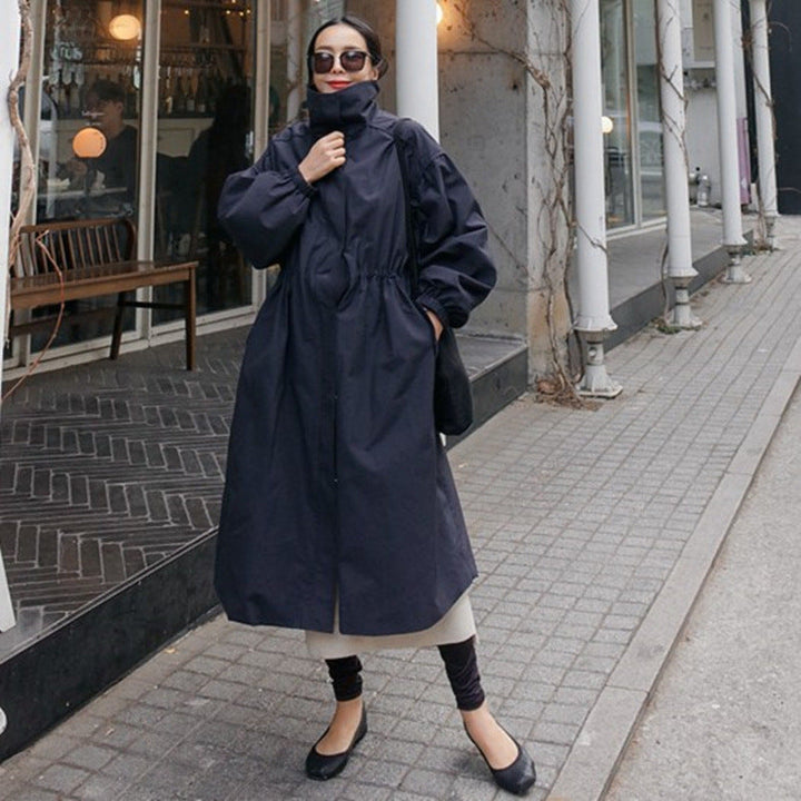 Women's oversized coat with stand-up collar, drawstring waist, and balloon sleeves