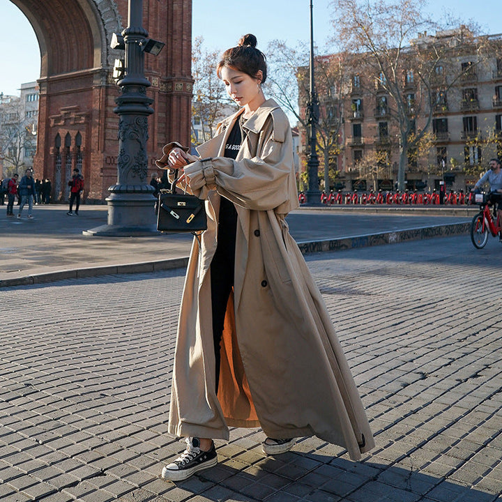 Women's oversized trench coat with balloon sleeves and a waist belt