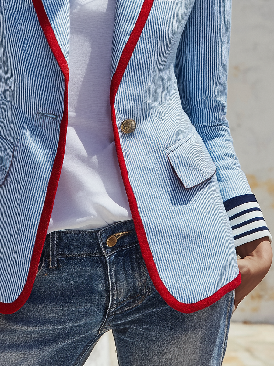 Striped women’s blazer with long sleeves, pockets, and buttons