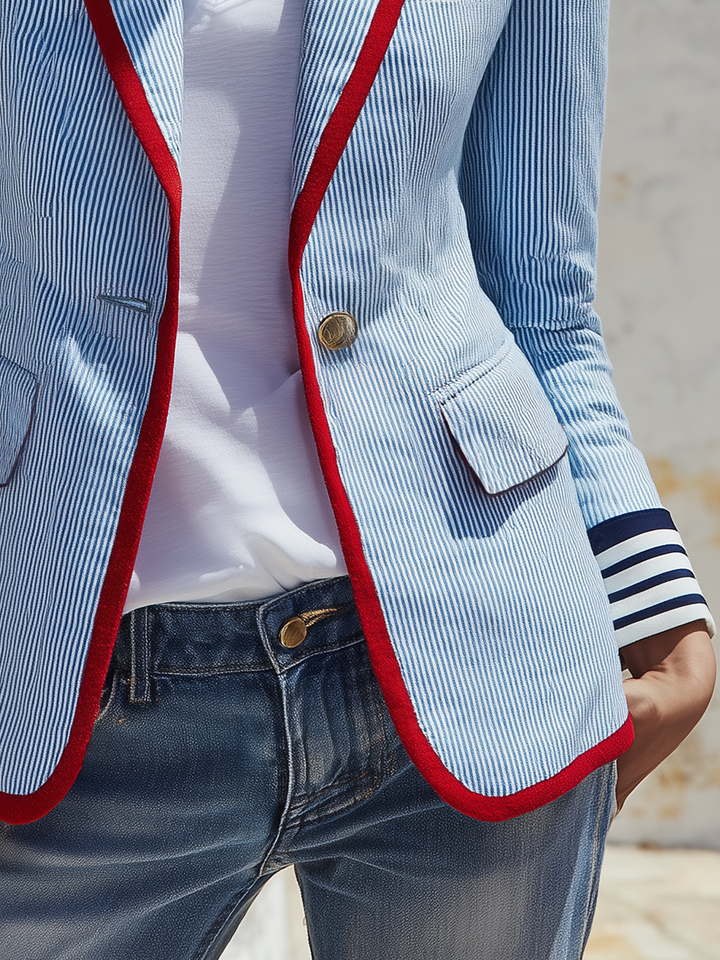 Striped women’s blazer with long sleeves, pockets, and buttons