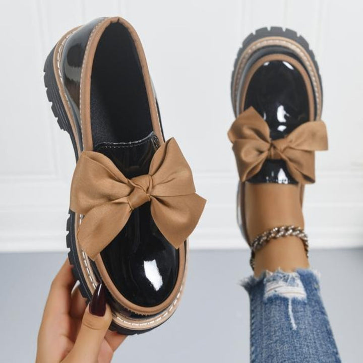 Shiny green loafers with a chunky padded sole