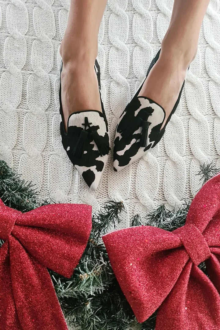 COW PRINT LOAFERS WITH TASSELS