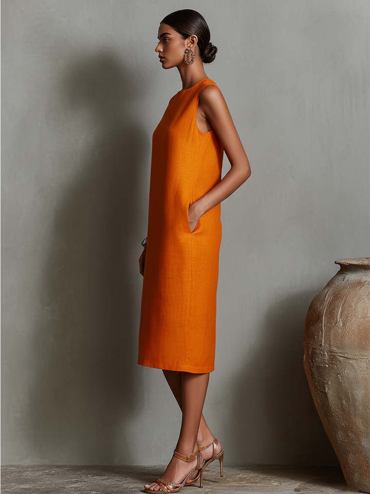Women's orange sheath dress with sleeveless crew neck and side pockets, timeless minimalist-elegant style