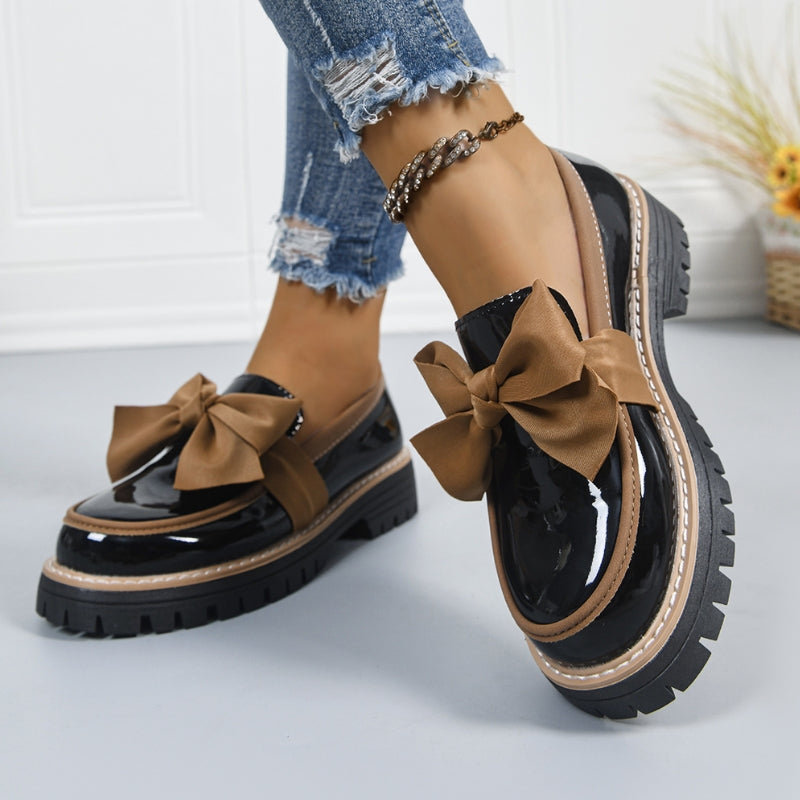 Shiny green loafers with a chunky padded sole