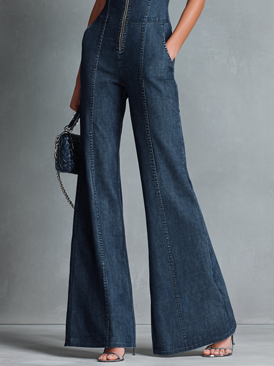 Women's dark blue retro-style sleeveless jumpsuit with stand-up collar, flared cut, and front zip.