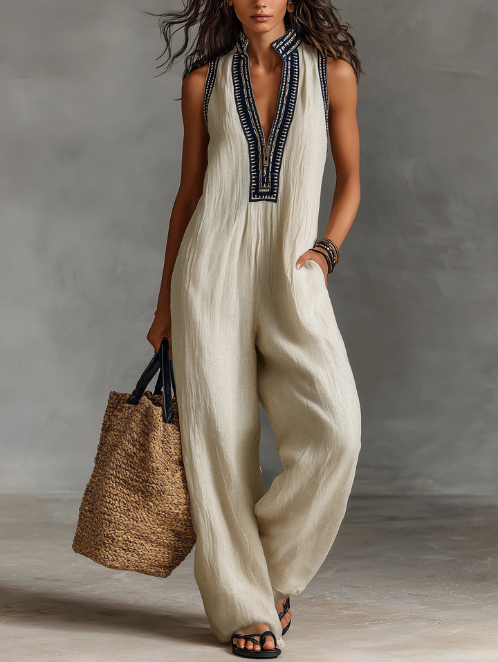 Minimalist, sleeveless women's jumpsuit with a zip-up stand-up collar, decorated with embroidery