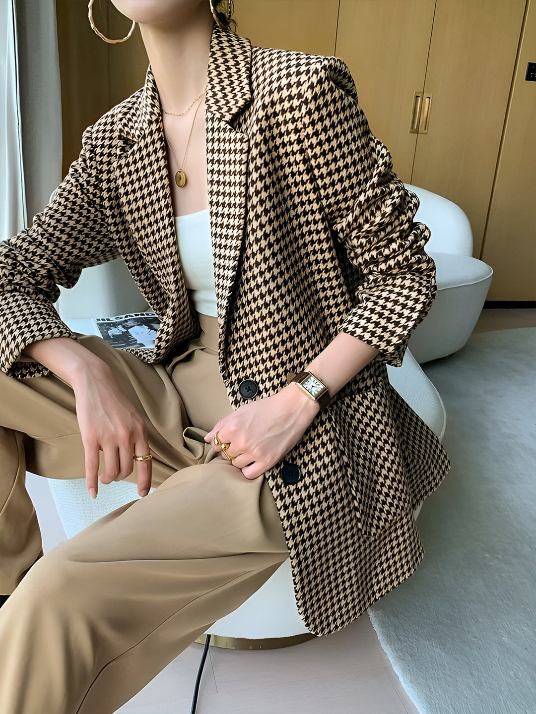 Women's houndstooth blazer with belt, buttons, and pockets
