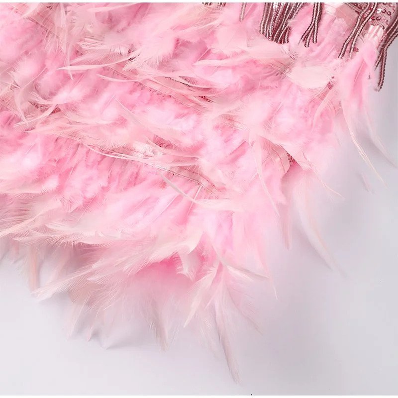 Figure-flattering feathered mini dress