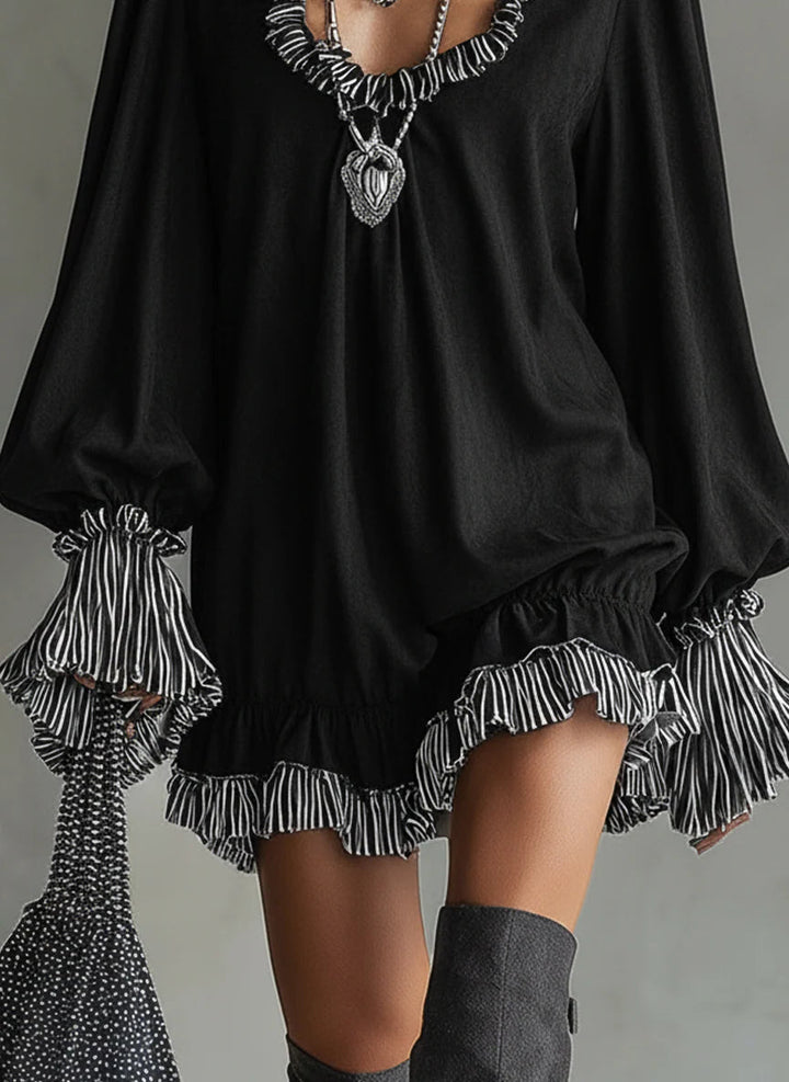 Faux suede mini dress with black stripes and ruffle details