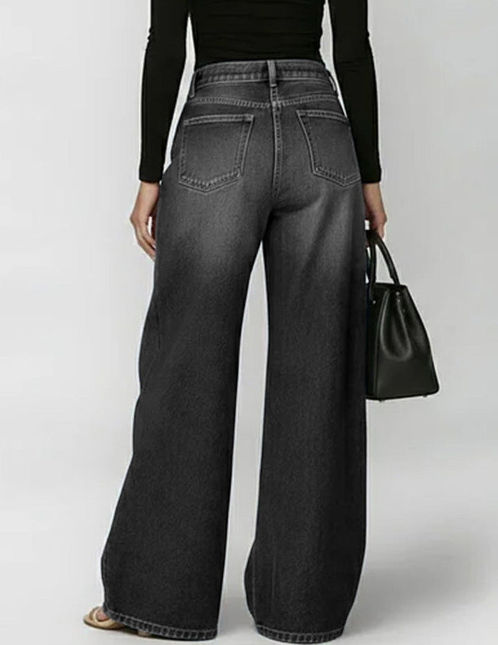 Wide denim trousers with golden eyelet side cut-outs