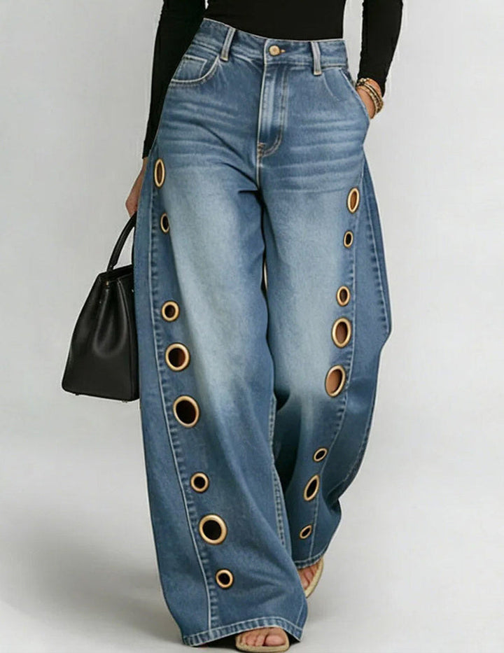 Wide denim trousers with golden eyelet side cut-outs