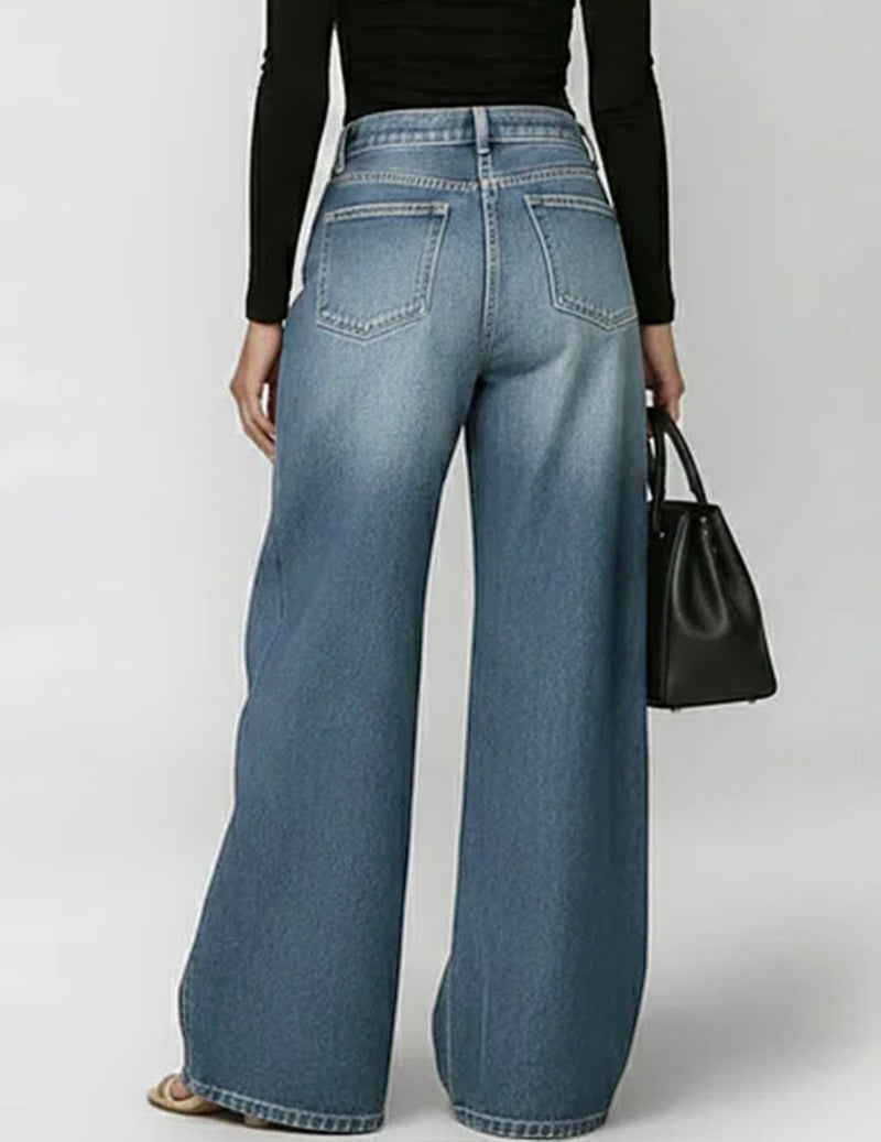 Wide denim trousers with golden eyelet side cut-outs