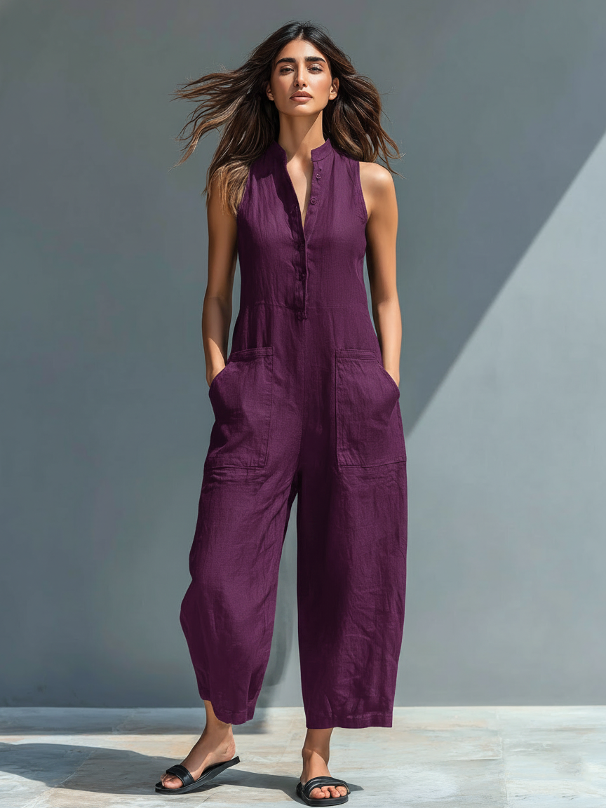 Minimalist women's jumpsuit with a stand-up collar, button placket, and a casual, loose fit