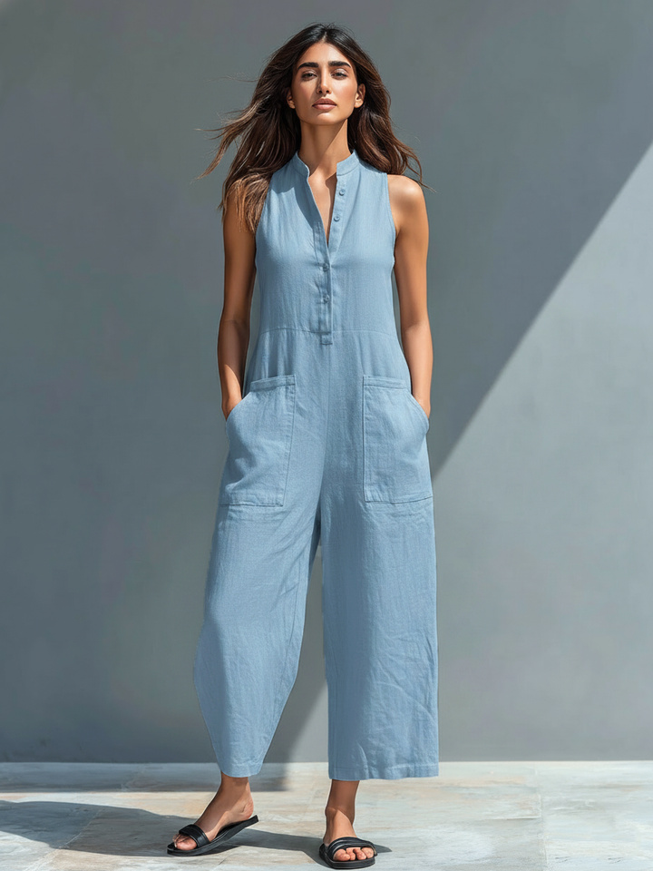 Minimalist women's jumpsuit with a stand-up collar, button placket, and a casual, loose fit