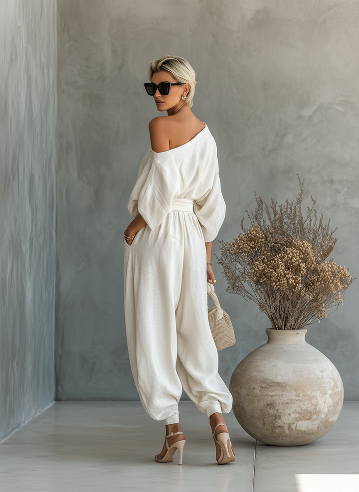 Set of off-the-shoulder, loose-fit women's blouse and slim-fit trousers