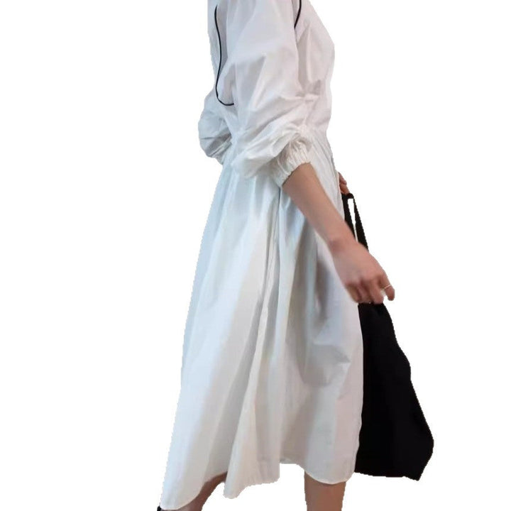 Women's lightweight windbreaker coat with a drawstring waist and raglan sleeves