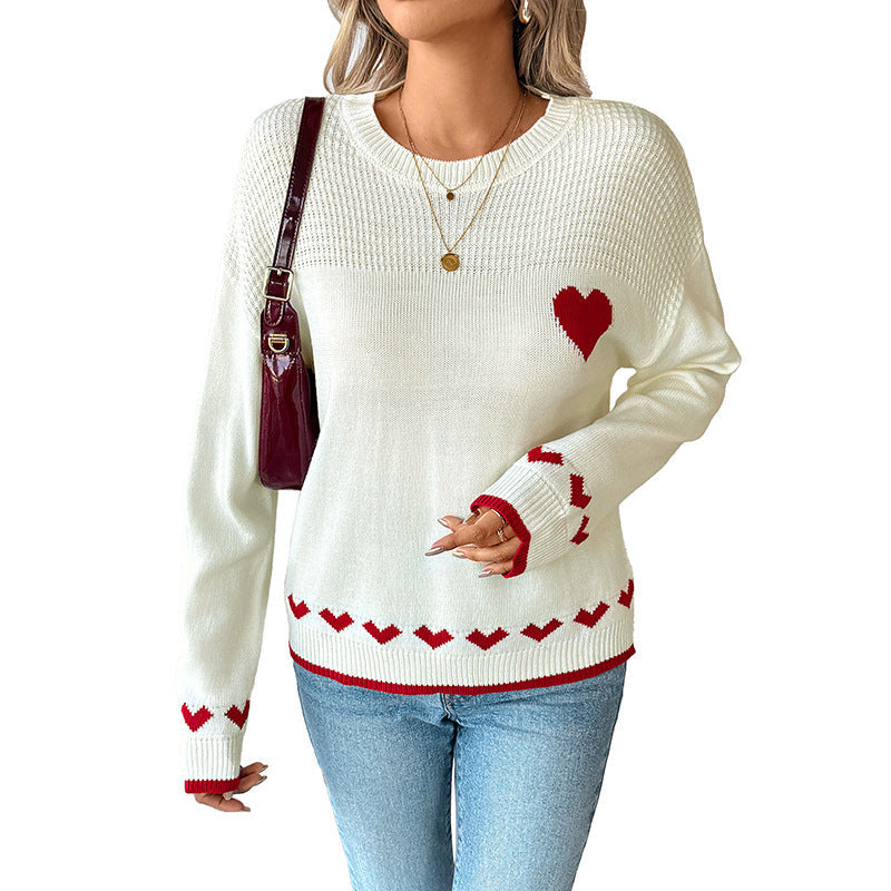 Women's sweater with a round neckline, heart intarsia, and ribbed cuffs