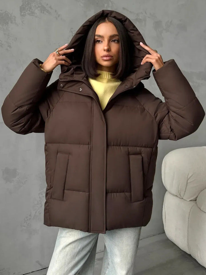 Women's oversized quilted jacket with a hood and integrated pockets
