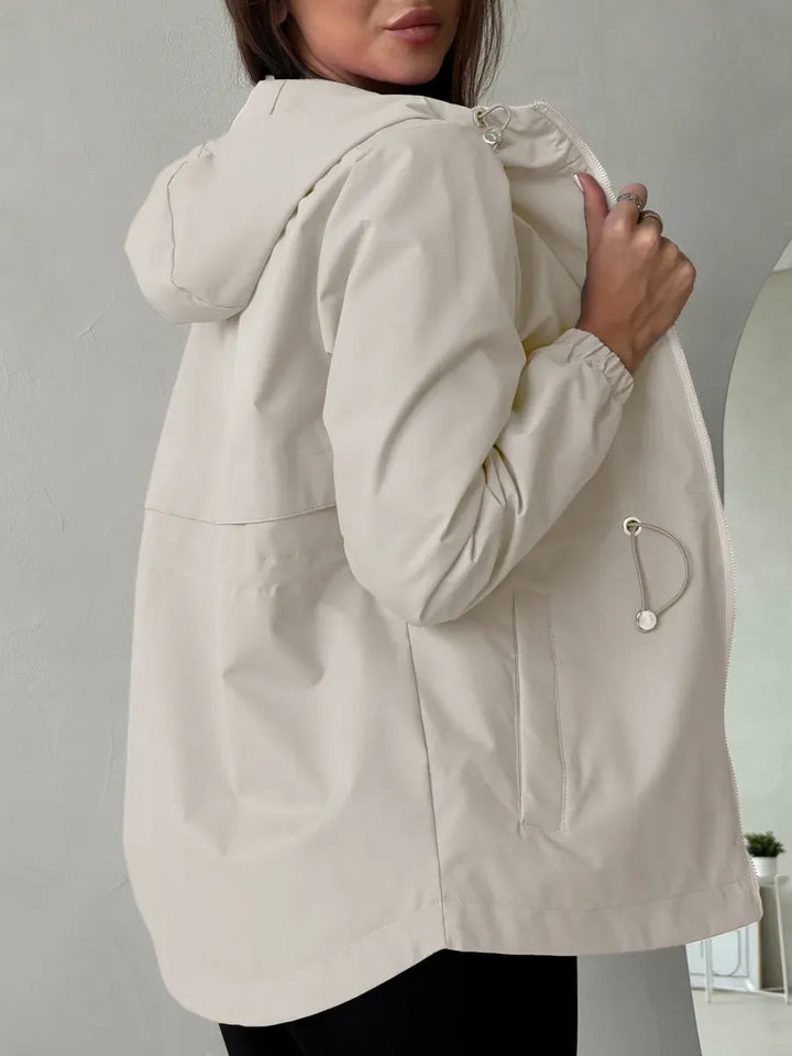 Women's outdoor jacket with adjustable hood and spacious pockets