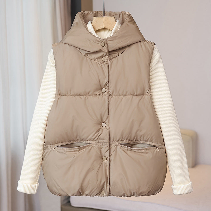 Women's padded sleeveless quilted vest with a voluminous stand collar and zippered pockets