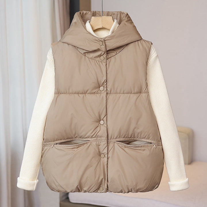 Women's padded sleeveless quilted vest with a voluminous stand collar and zippered pockets