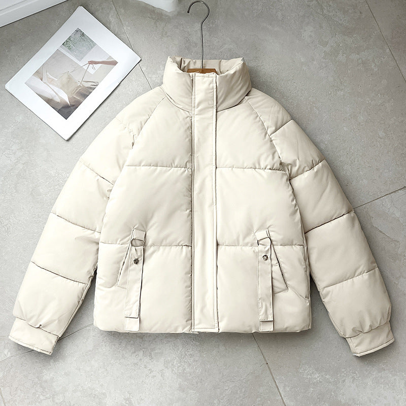 Women’s short quilted jacket with a high stand-up collar and D-ring pocket