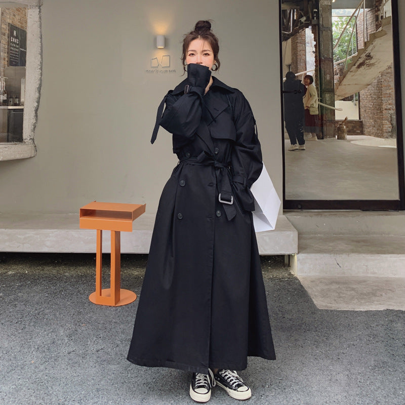 Women's oversized trench coat with double-breasted button fastening and storm flap