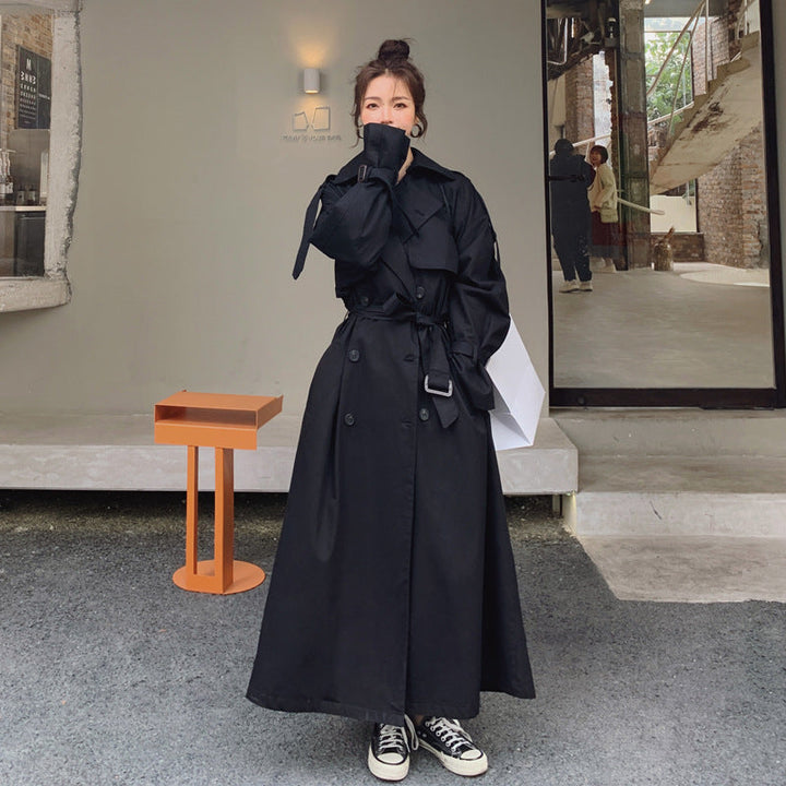 Women's oversized trench coat with double-breasted button fastening and storm flap
