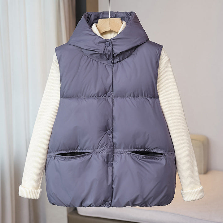 Women's padded sleeveless quilted vest with a voluminous stand collar and zippered pockets