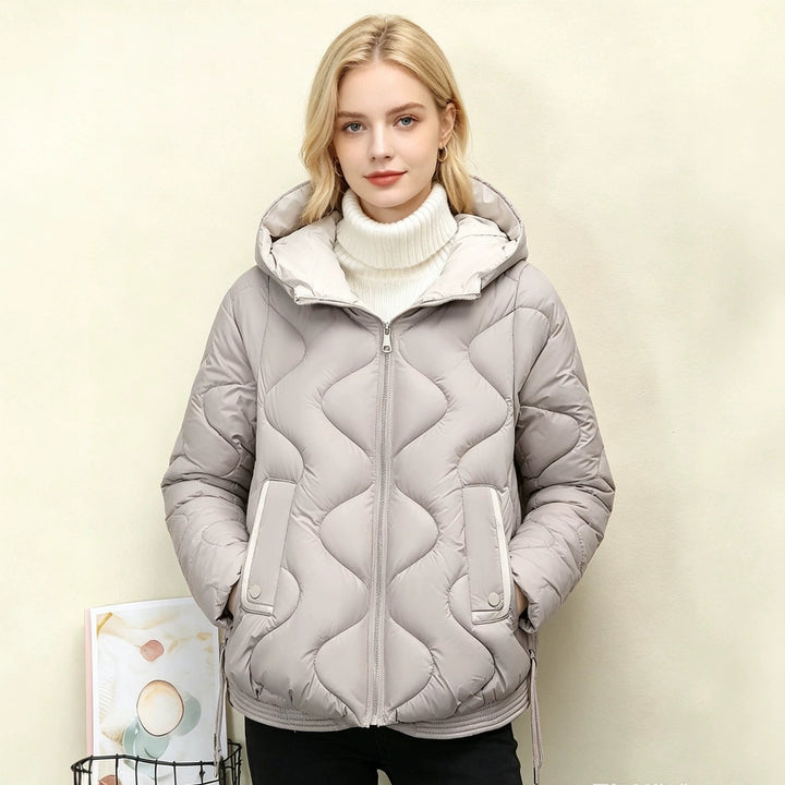 Women's padded short jacket with heart-shaped quilting, a rounded hem, and a hood