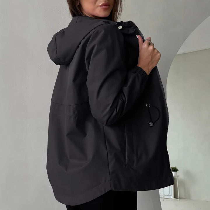 Women's outdoor jacket with adjustable hood and spacious pockets