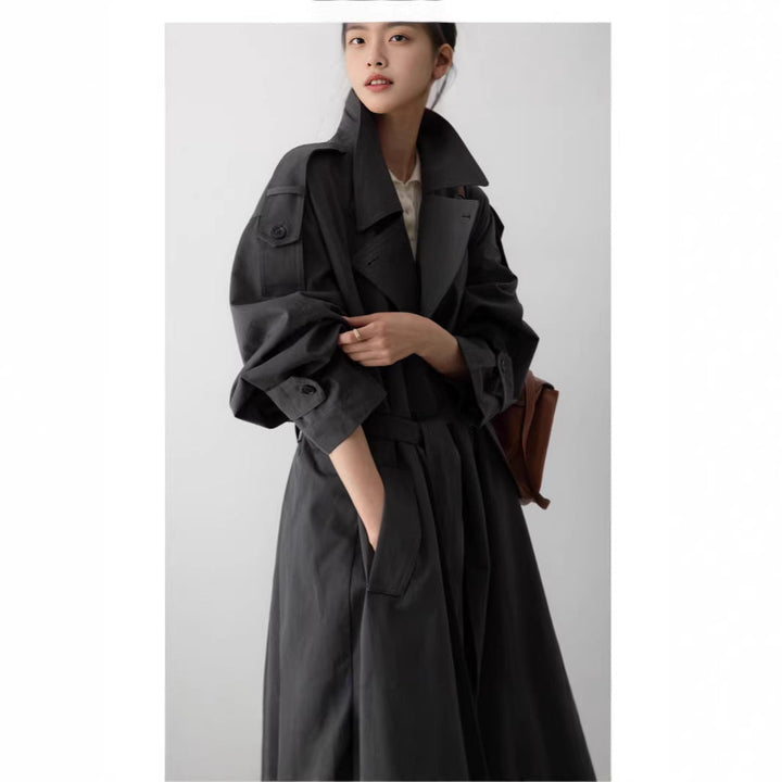Women's oversized maxi-length trench coat with waist belt and epaulettes