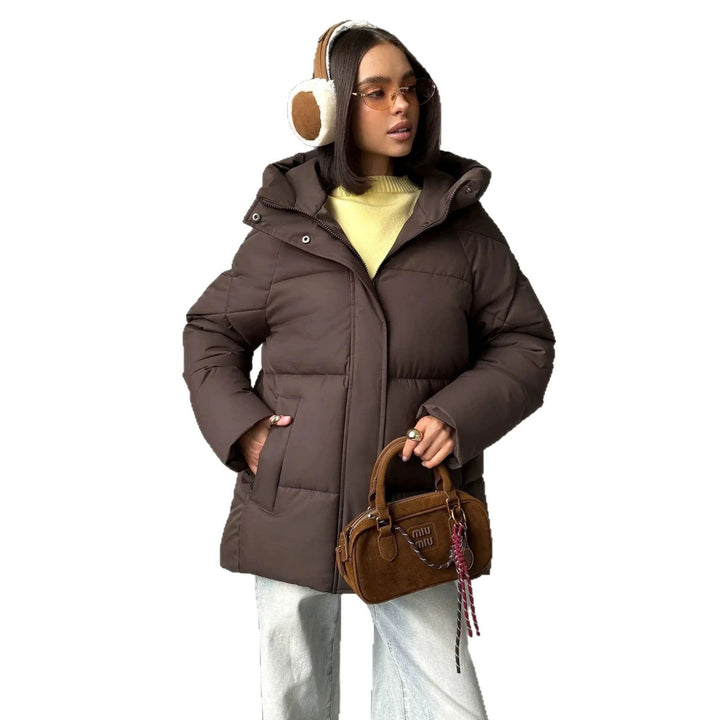 Women's oversized quilted jacket with a hood and integrated pockets
