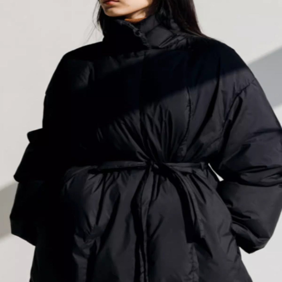 Women’s longline parka with a wrap belt and voluminous sleeves