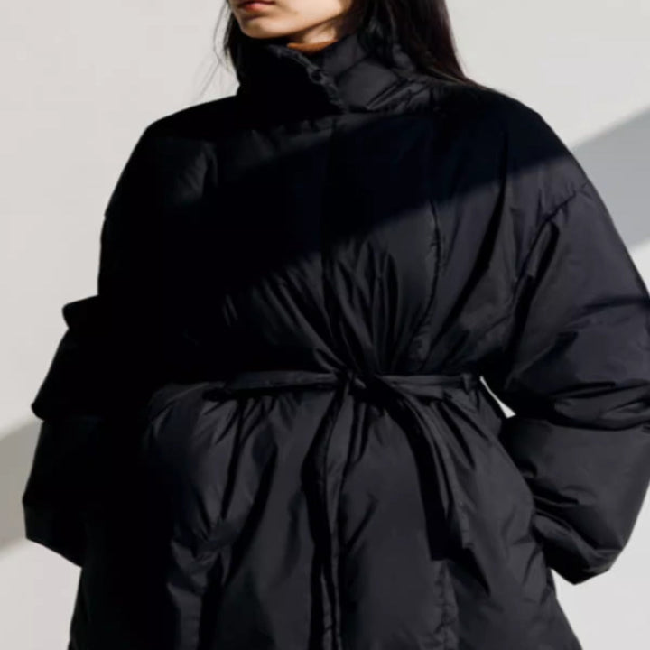 Women’s longline parka with a wrap belt and voluminous sleeves
