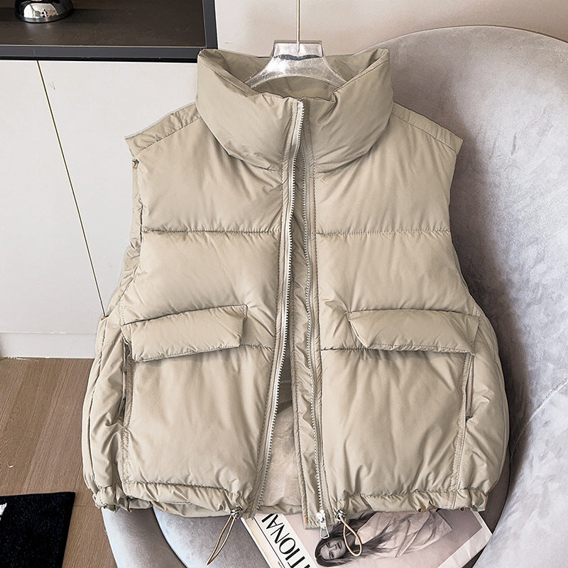Women's short insulated microfiber quilted vest with a high stand-up collar and drawstring hem