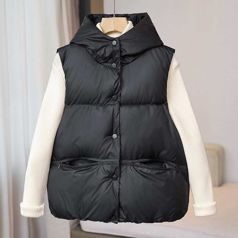 Women's padded sleeveless quilted vest with a voluminous stand collar and zippered pockets