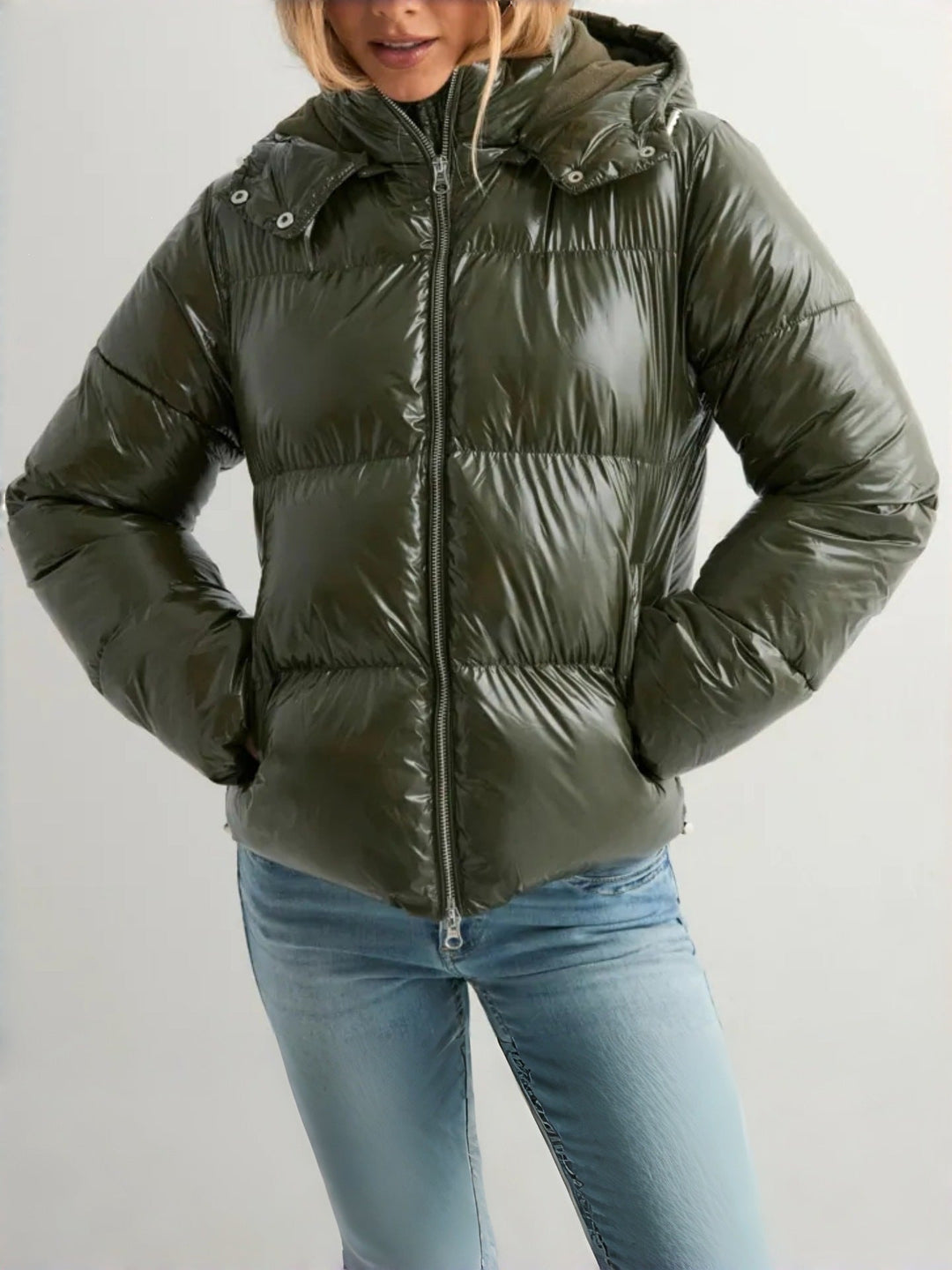 Women's quilted jacket with an adjustable hood and zippered pockets
