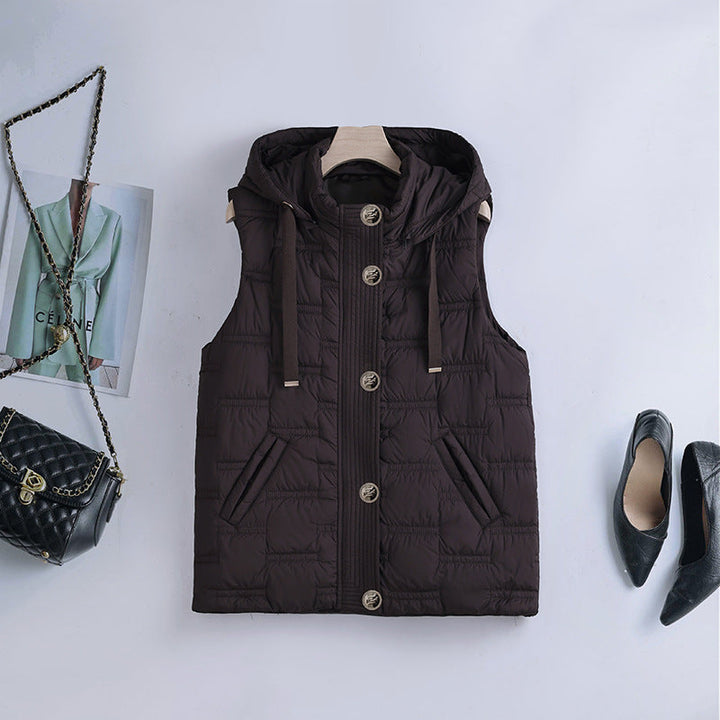 Women’s sleeveless quilted hooded vest with concealed button placket and welt pockets