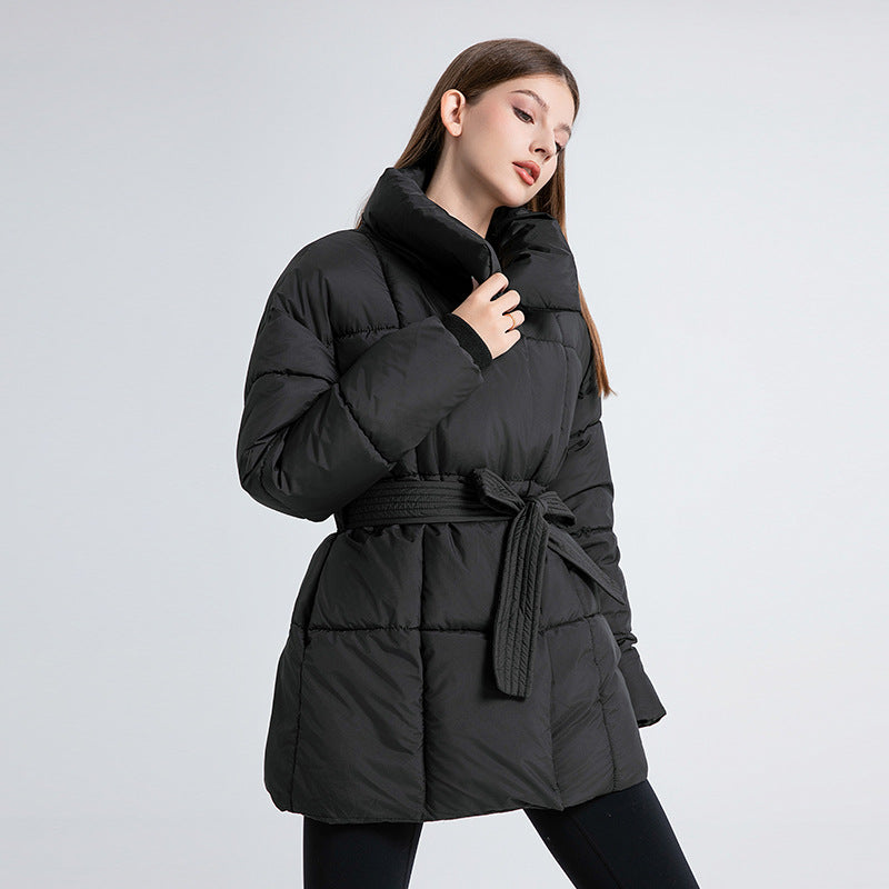 Women's fitted quilted coat with a tie belt and high shawl collar