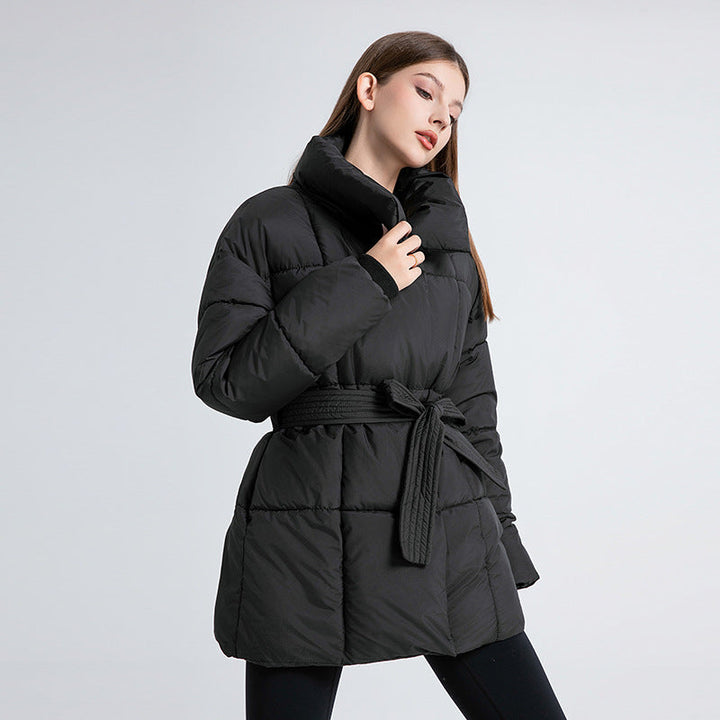Women's fitted quilted coat with a tie belt and high shawl collar