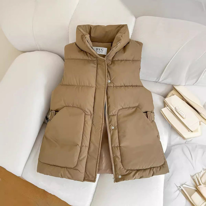 Women’s padded utility vest with stand-up collar and large flap pockets