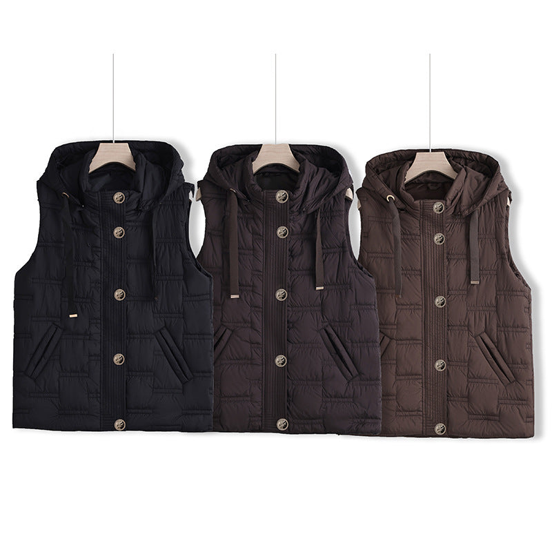 Women’s sleeveless quilted hooded vest with concealed button placket and welt pockets