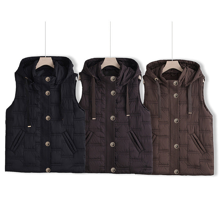 Women’s sleeveless quilted hooded vest with concealed button placket and welt pockets