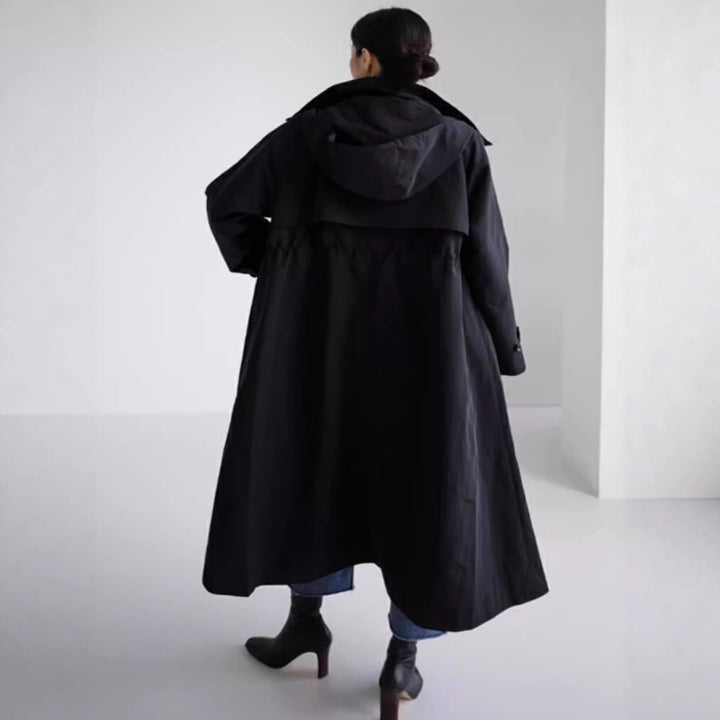 Women’s water-repellent oversized raincoat with hood and A-line silhouette