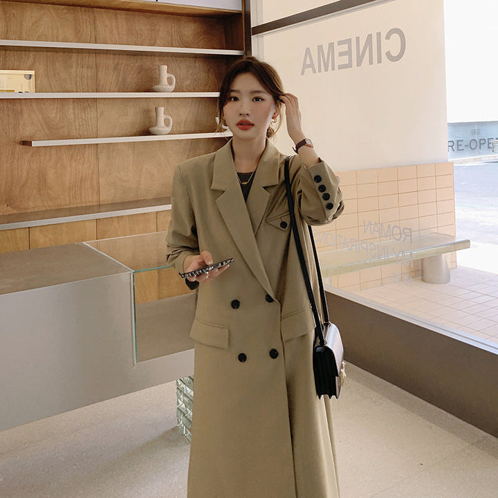 Women’s double-breasted oversized trench coat with lapels and an elongated cut
