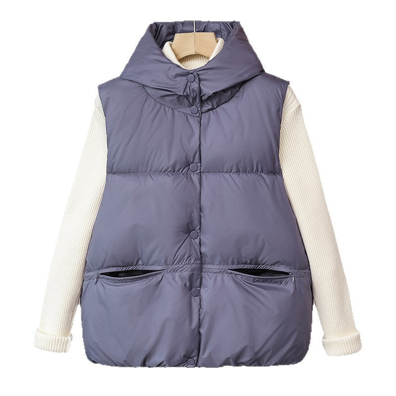 Women's padded sleeveless quilted vest with a voluminous stand collar and zippered pockets
